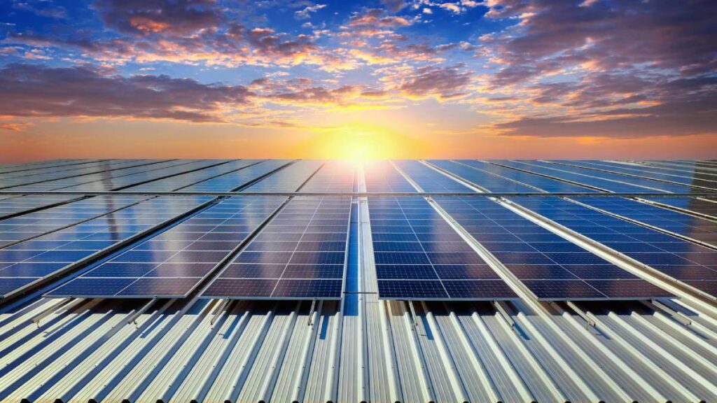 Sunlight reflects off solar panels on a rooftop